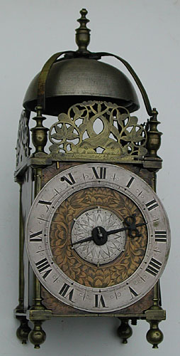 Full view of the Thomas Knifton clock, signed on the front dolphin fret. Fine engraving.