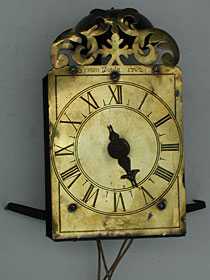tiny single-handed hook-and-spike wall clock made in 1762 by Simon Douta